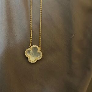 Rachel Zoe mother pearl  in one side,black other side with 4 clover leaf Pendant